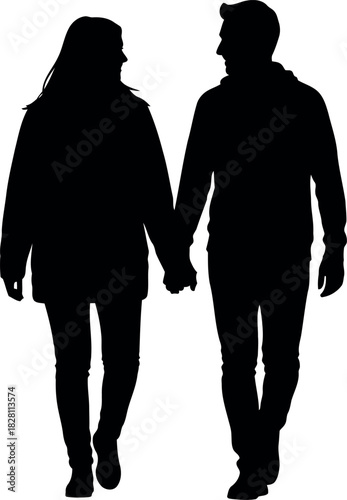 Silhouette of a loving couple holding hands and walking together