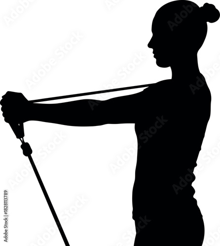 Woman silhouette exercising with resistance band for fitness.