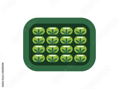 A green rectangular tray containing sixteen small green oval shapes, each with a stylized leaf pattern.