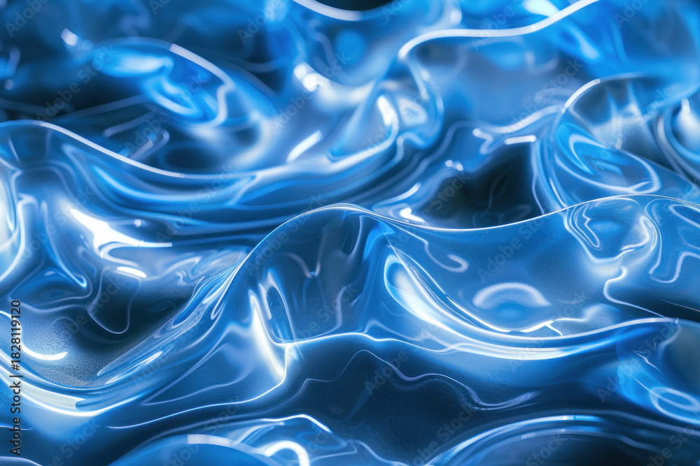 Obraz premium Abstract blue waves with a glossy surface. The texture appears fluid and reflective, creating a sense of movement and depth.