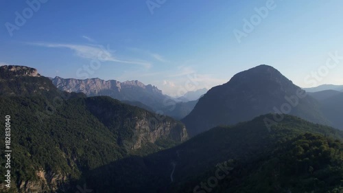 4K Aerial Drone video of Alpine lake Thumsee with turquoise water and lush green woods surrounded by tall mountains at sunset golden hour in Bad Reichenhall Germany