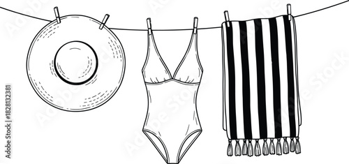 Summer essentials hanging on a clothesline black and white