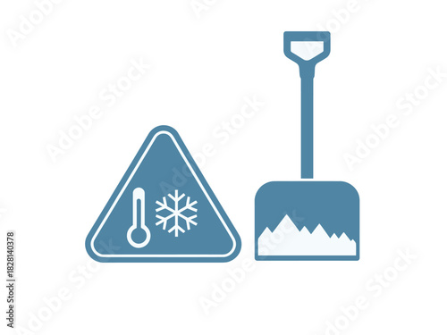 A warning sign for cold weather and a shovel for snow removal are displayed.