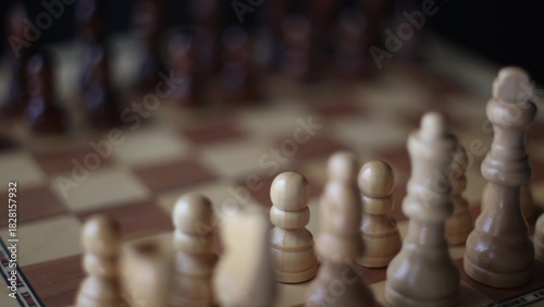 Animated sequence showing chess pieces on revolving board, capturing the essence of strategic decision-making and the black versus white dichotomy in chess