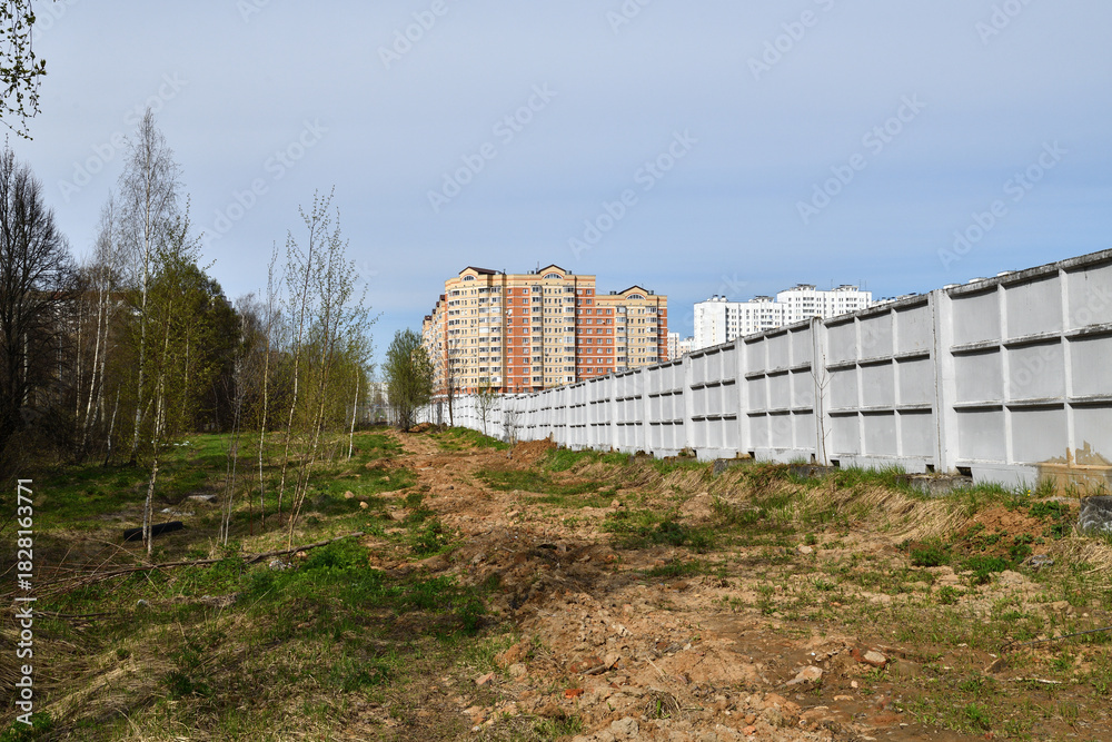Fototapeta premium precast reinforced concrete fence consisting of individual panels,