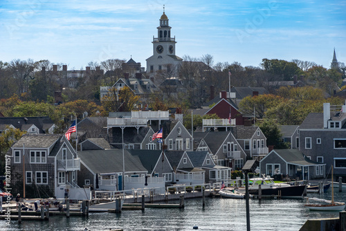 Aerial view of the town with the iconic church steeple rising above the historic buildings, a symphony of architectural heritage, Nantucket, Massachusetts, United States.
