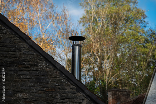 Wood Burner flue terminal sited on a sloping roof