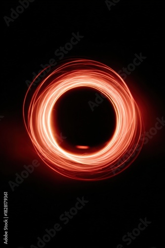 Abstract glowing red light circle on black background