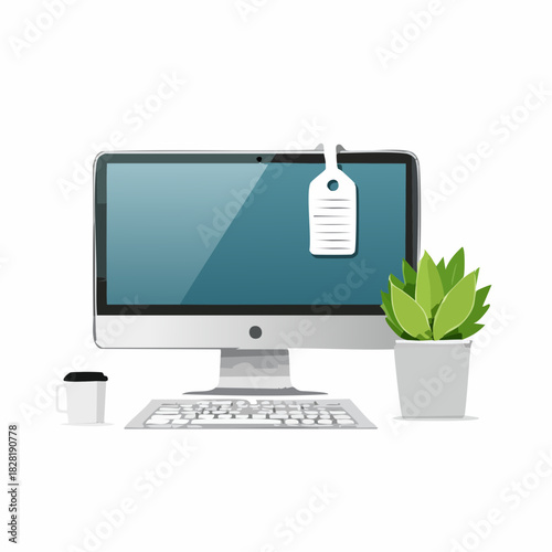 Modern computer workspace with plant and coffee cup.