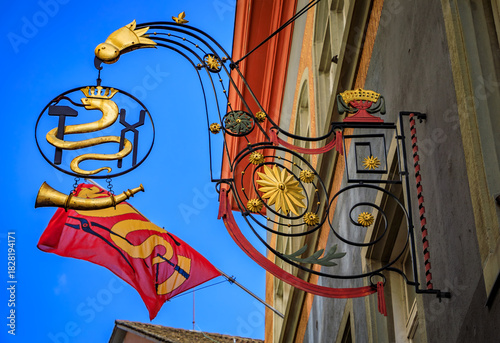 Historic ornate wrought iron smiths guild sign with a snake, Zurich, Switzerland