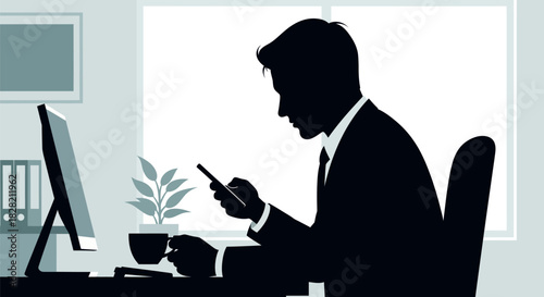 Silhouette of a business professional at an office desk, engrossed in his phone, with a computer and plant