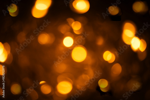 Blurred Christmas lights background with golden holiday bokeh. Abstract New Year banner