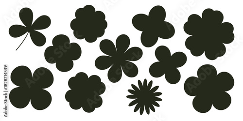 A collection of black flower silhouettes with varying petal shapes on a white background