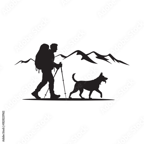 Silhouette of hiker and dog in mountains