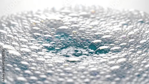 Captivating CloseUp of Water Pouring into a Basin A Mesmerizing Display of Liquid Dynamics Bubbles and Reflections Perfect for Illustrating Purity Cleanliness and the Refreshing Power of Water.