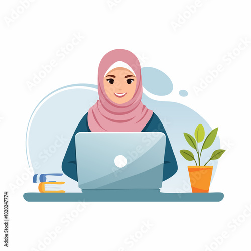 Woman in hijab working on laptop at desk.