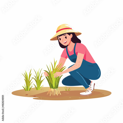 Female farmer planting young crops in a field.