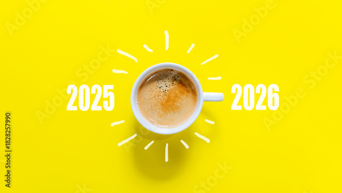 Happy new year and Merry Christmas 2026. Cup of coffee change and download 2025 to 2026 on yellow background. Start up and New Year Concept. Copy space
