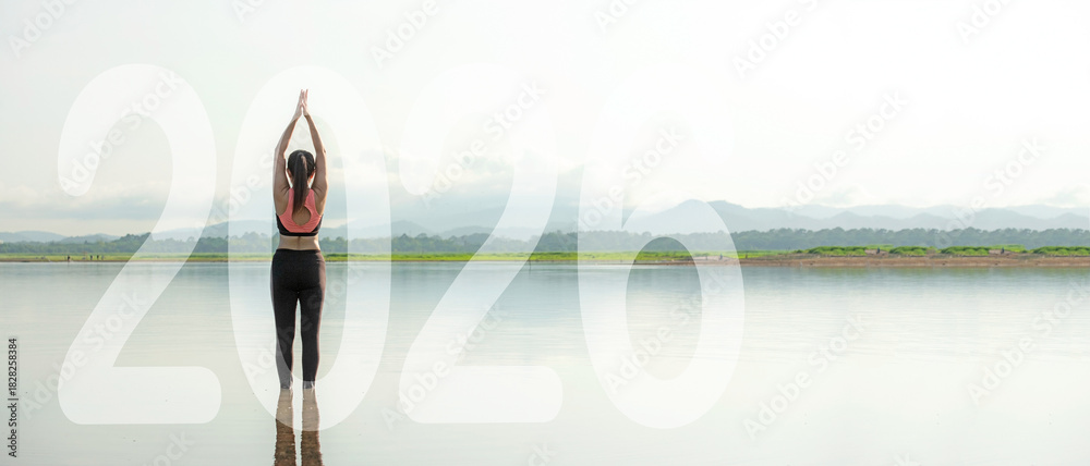 Obraz premium Happy new year start up 2026. Yoga women lifestyle exercise and pose for healthy life. people balance body vital zen and meditation for workout sunrise morning nature background for success 2026