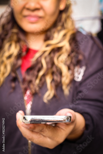 Wallpaper Mural Woman using smartphone outdoors in casual jacket Torontodigital.ca