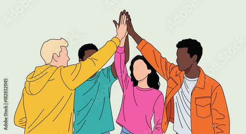 Diverse team celebrating success with a high five symbolizing unity and collaboration