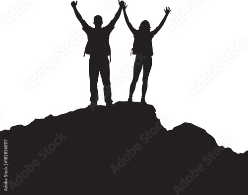 Two people silhouetted on mountain peak with arms raised