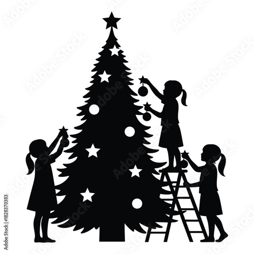 Silhouette of children decorating a christmas tree with star topper and ornaments