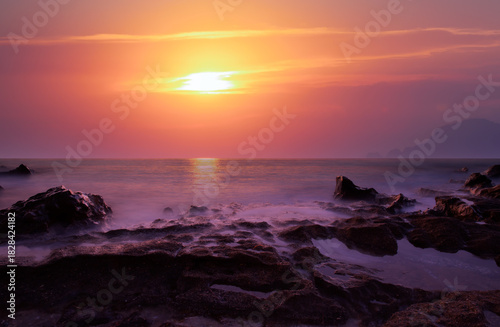 Fototapeta Naklejka Na Ścianę i Meble -  Long exposure photo of sunset on a rocky beach - Alanya, Turkey