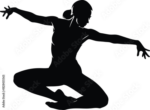 Silhouette of a female dancer in a dynamic pose
