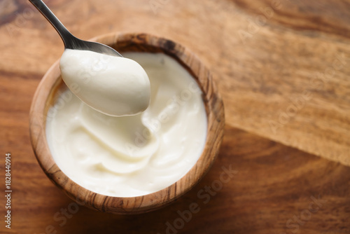 Pov shot of full spoon of yogurt