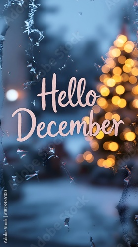 December text with blurred Christmas tree lights bokeh and frost on window glass creating cozy winter holiday atmosphere background
