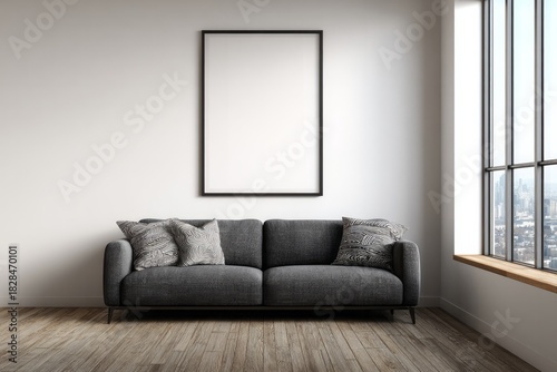 Modern living room with a gray sofa and large window view.