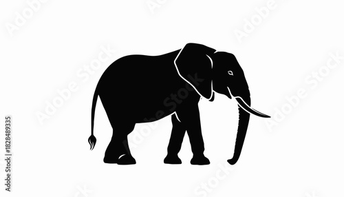 A striking black silhouette of an African elephant with its trunk curled downwards, set against a stark white background.