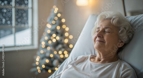 grandmother with peaceful festive mood resting and making a wish in a nursing home room against a Christmas tree and snowy window backdrop
