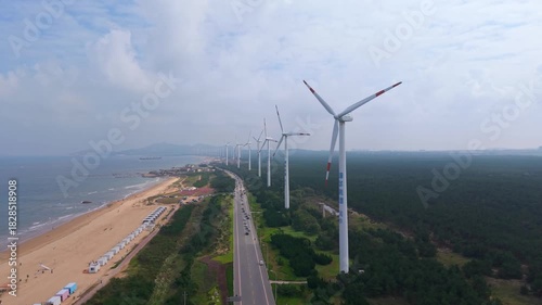 Massive offshore wind farm along coastal highway and beach, aerial China