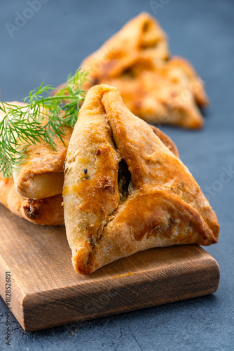Homemade triangular pastry with spinach and cheese. A traditional Middle Eastern dish.