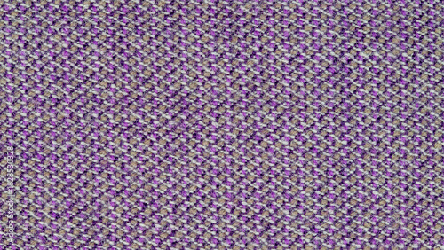 Close-up photo of fabric texture for use as background. The fabric is made from a mixture of purple, gray, and pale orange threads. A mixture of synthetics and wool. Abstract pattern.