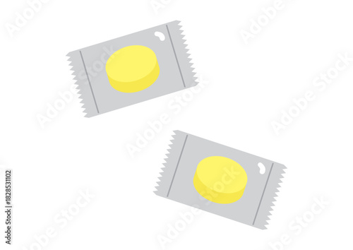 個包装の黄色いあめ、2袋