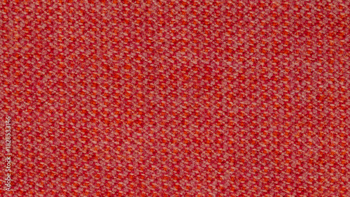 Close-up photo of fabric texture for use as background. The fabric is made from a mixture of pink, orange, and white threads. A mixture of synthetics and wool. Abstract pattern.