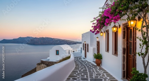 Fototapeta Naklejka Na Ścianę i Meble -  Santorini Serenity: A picturesque scene of Santorini, Greece, unveils a charming alleyway adorned with whitewashed buildings, blooming flowers, and inviting street lamps.