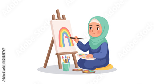 Young girl wearing hijab painting colorful rainbow on canvas in artistic