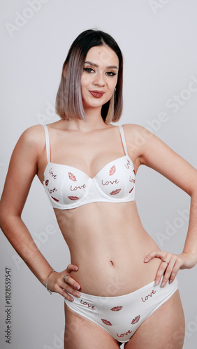 Woman in white bra with red roses
