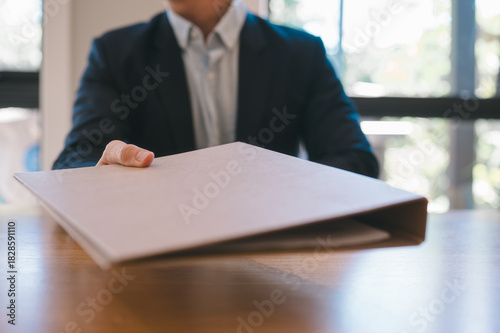 businessman hand holding or handing over document, documentation, document data management system, Document data system Report HR technology Concept