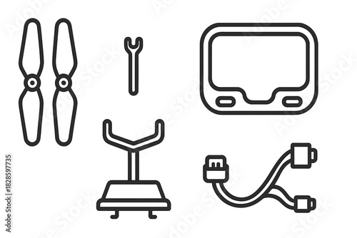 Essential FPV drone accessories set featuring propellers, goggles, charging cable, and stand