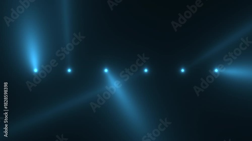 atmospheric haze and sweeping blue spotlights create energetic concert environment