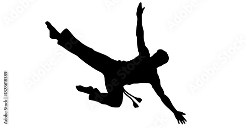 Dynamic capoeira acrobat silhouette strikes a powerful pose mid-air, showcasing strength, agility