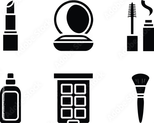 Collection of cosmetic products including lipstick, brush, mascara and eyeshadow palette items for makeup