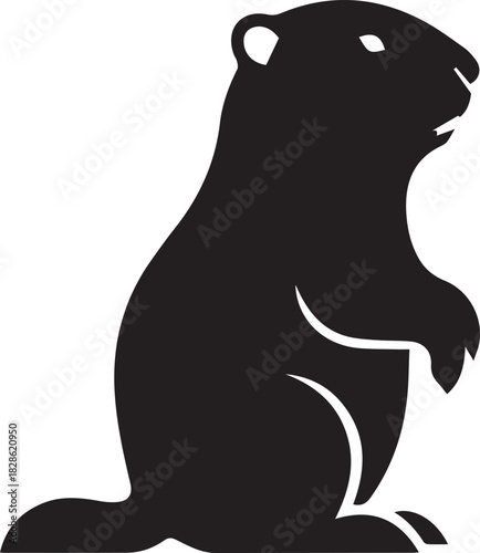 Black silhouette of a groundhog standing on its hind legs