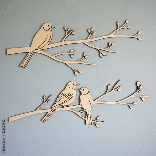 Two wooden bird silhouettes on branches isolated on white background