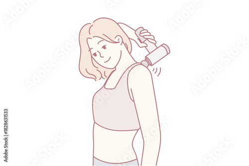 Postexercise woman with towel, Athletic woman relaxes following vigorous training routine, Healthconscious female athlete wears towel and sports top after intense training session